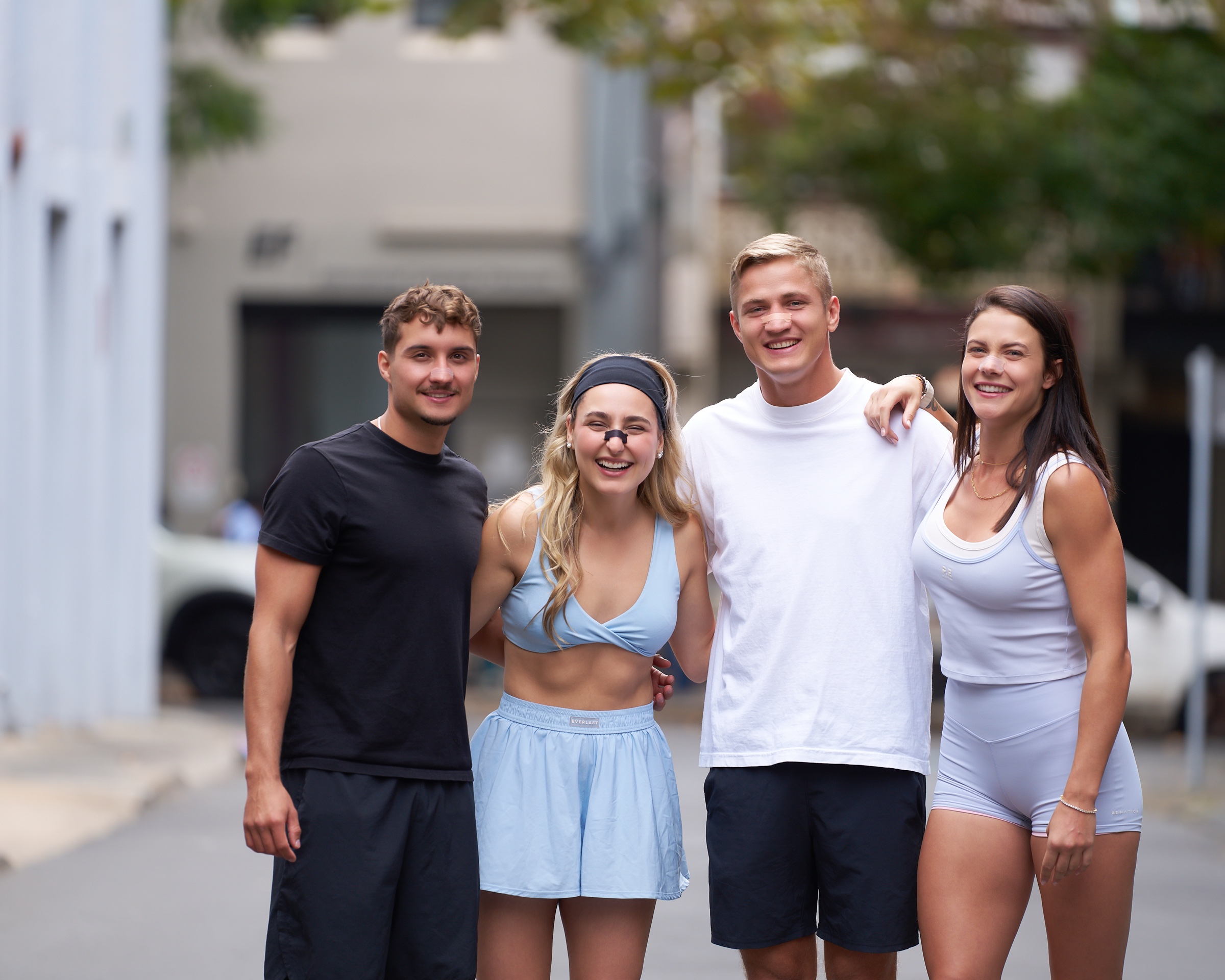 Friends in the street wearing Nozey strips