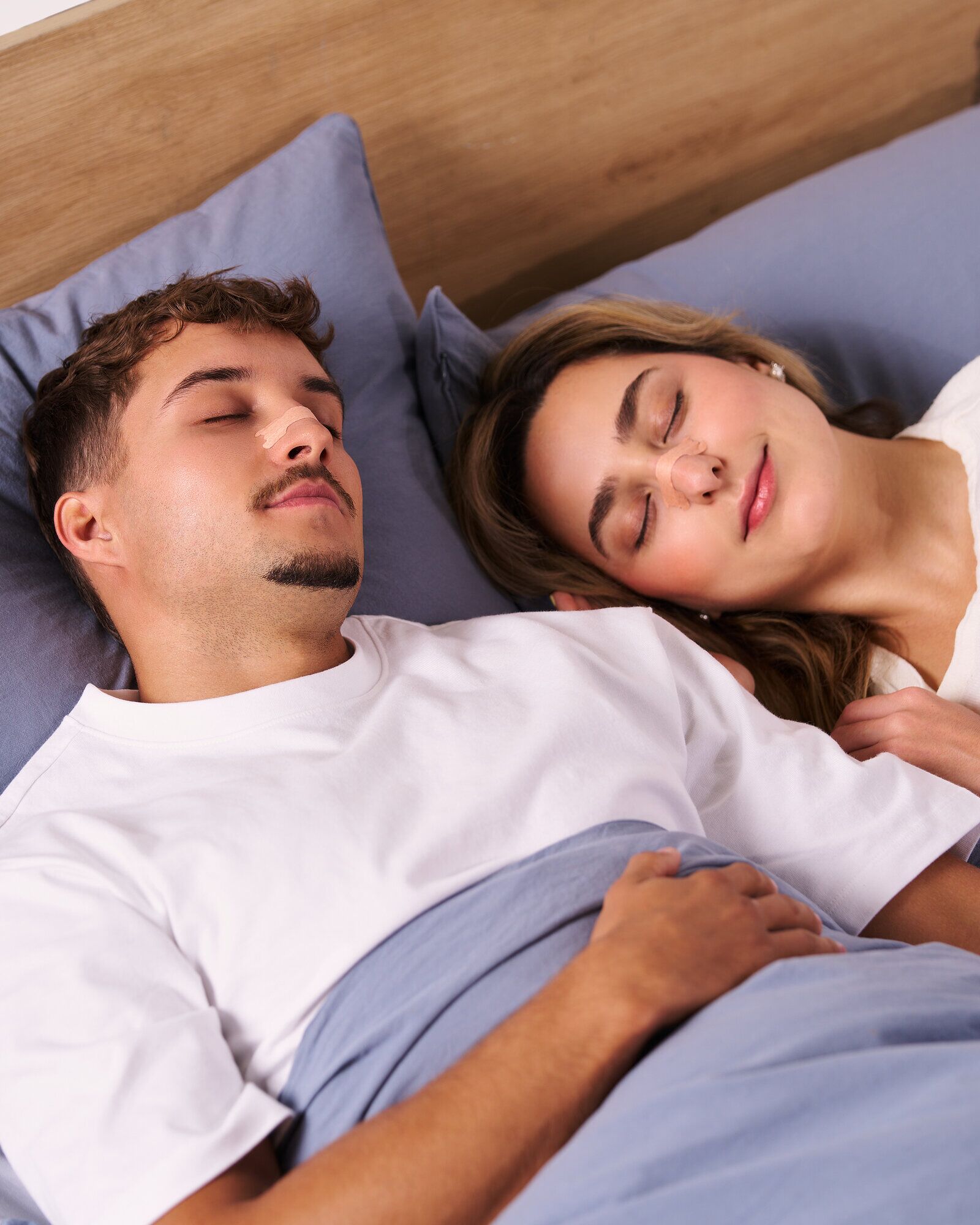 Couple asleep wearing Nozey strips